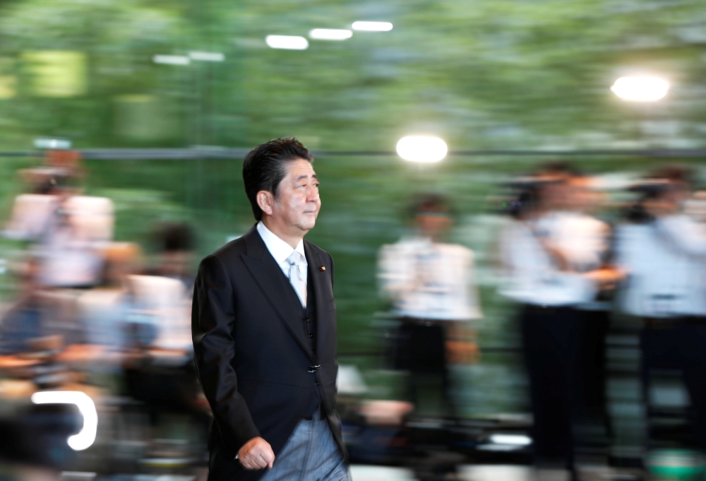 Japan's Prime Minister Shinzo Abe wearing formal costume leaves his official residence to attend an attestation ceremony at the Imperial Palace, in Tokyo, Japan October 2, 2018. REUTERS/Issei Kato