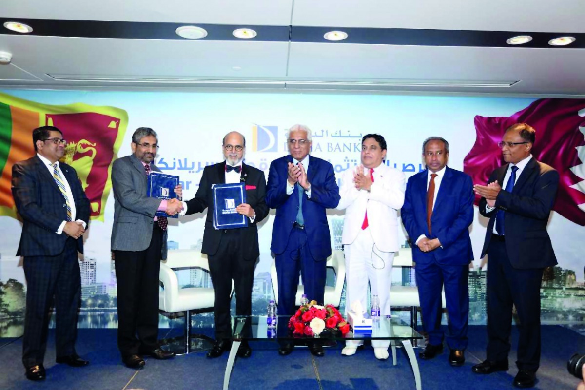 Doha Bank CEO Dr R Seetharaman (third left) shakes-hands with DPK Gunasekara (second left), Deputy General Manager, Treasury & International, Bank of Ceylon, as Sri Lanka’s Central Bank Governor Dr Indrajit Coomaraswamy (centre);  Sri Lankan Ambassador to