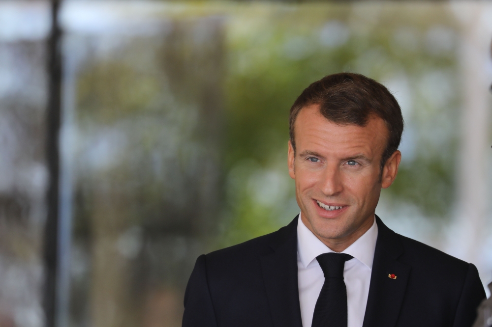 French president Emmanuel Macron attends a ceremony by the grave side of former French statesman General de Gaulle, founder of the Fifth Republic, on the 60th anniversary of the Constitution of the Fifth Republic, on October 4, 2018 in Colombey-les-deux-E