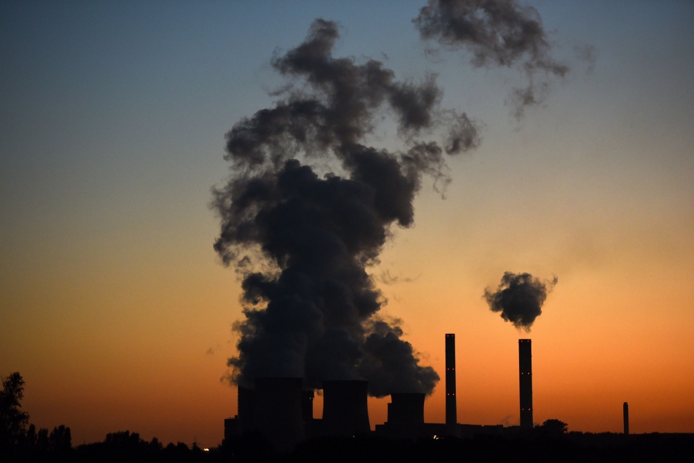 This file photograph shows smoke rising from the 