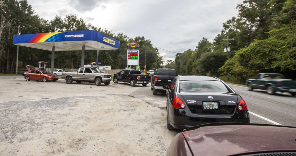 People line up for gasoline as Hurricane Michael bears down on the northern Gulf coast of Florida on October 8, 2018 outside Tallahassee, Florida.  Mark Wallheiser/Getty Images/AFP