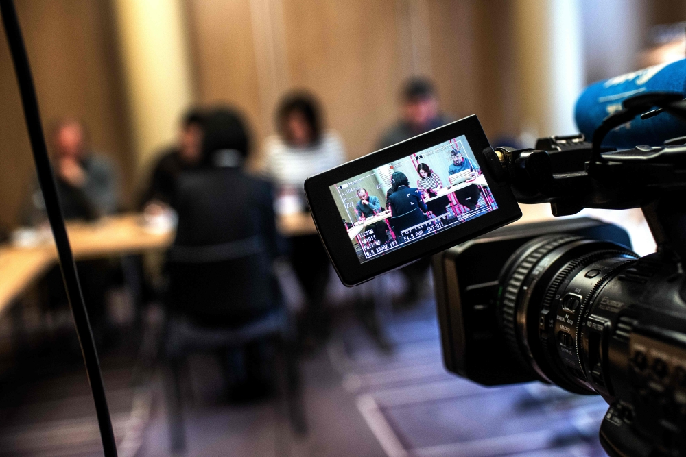 Grace, the wife of the missing Interpol president Meng Hongwey, talks to journalists on October 7, 2018 in Lyon during a press conference during which she did not want her face to be shown, a day after Interpol demanded an official 