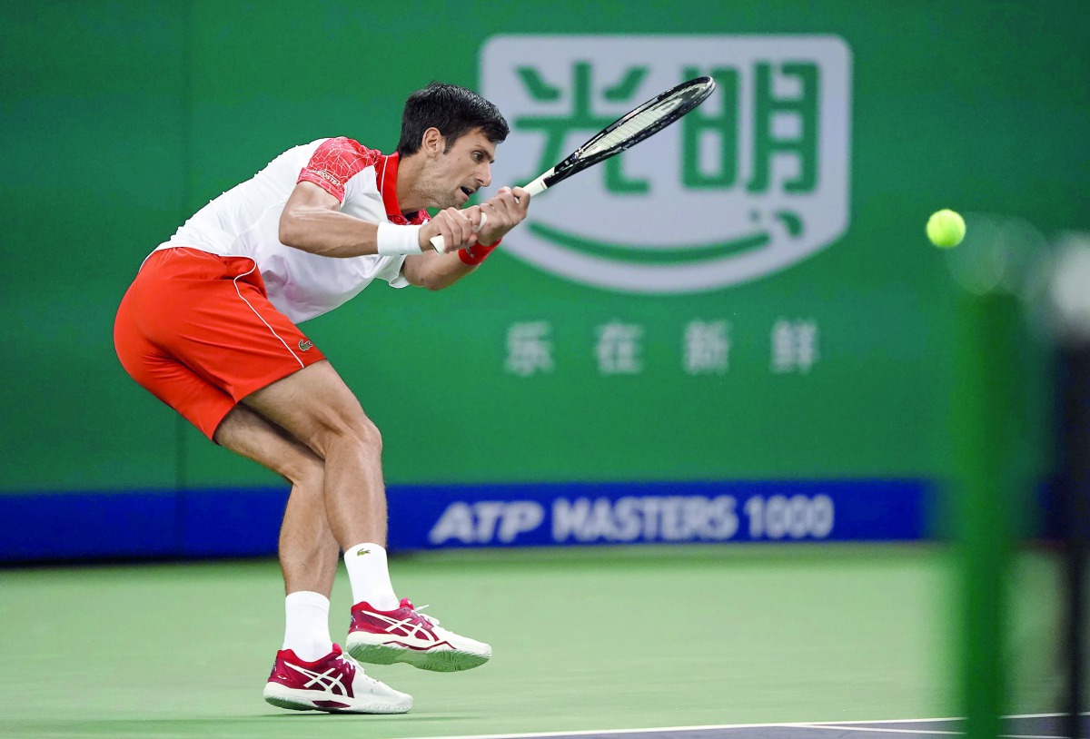 Novak Djokovic of Serbia hits a return against Jeremy Chardy of France during their men's singles first round match at the Shanghai Masters tennis tournament on October 9, 2018. AFP / Johannes Eisele
