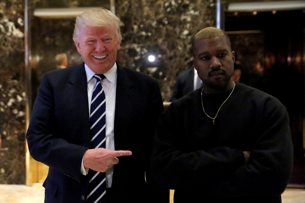 :FILE PHOTO: U.S. President-elect Donald Trump and musician Kanye West at Trump Tower in New York City on Dec 13, 2016. REUTERS/Andrew Kelly