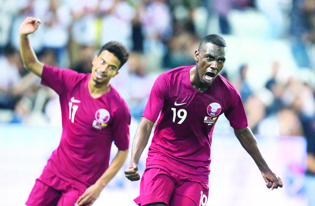 Qatari forward Almoez Ali (right) celebrates with team-mate Akram Afif after scoring his second goal during their international friendly match against Ecuador at the Al Sadd Stadium in Doha yesterday.