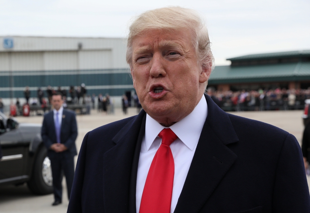 U.S. President Donald Trump speaks to reporters about the release of Pastor Andrew Brunson by Turkey after the president's arrival for an evening campaign rally in Cincinnati, Ohio, U.S., October 12, 2018. REUTERS/Jonathan Ernst
