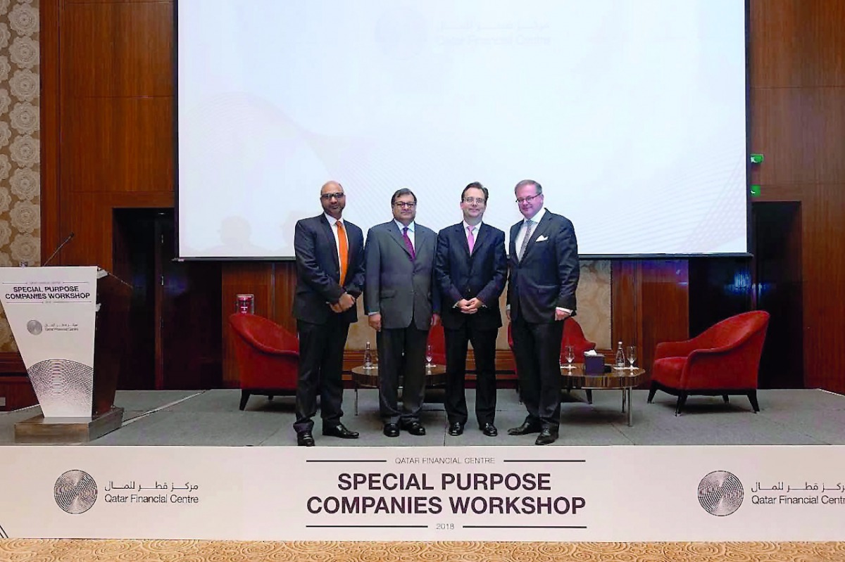 QFC and ISDA officials seen during the conference.