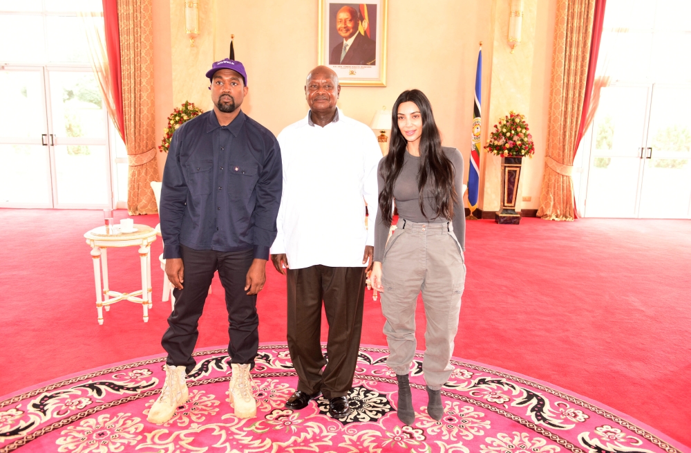 Rapper Kanye West (L) and Kim Kardashian (R) pose for a photograph with Uganda's President Yoweri Museveni when they paid a courtesy call at State House, Entebbe, Uganda October 15, 2018. Presidential Press Unit/Handout via REUTERS 