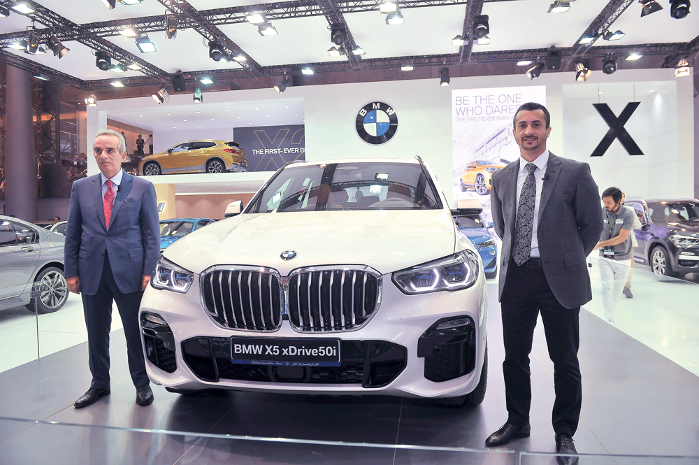 Rabih Ataya, General Manager of Alfardan Automobiles, and Ayser Maan, Area Sales Manager at BMW Group Middle East, during the lauch at Qatar Motor Show 2018 held at the DECC yesterday.