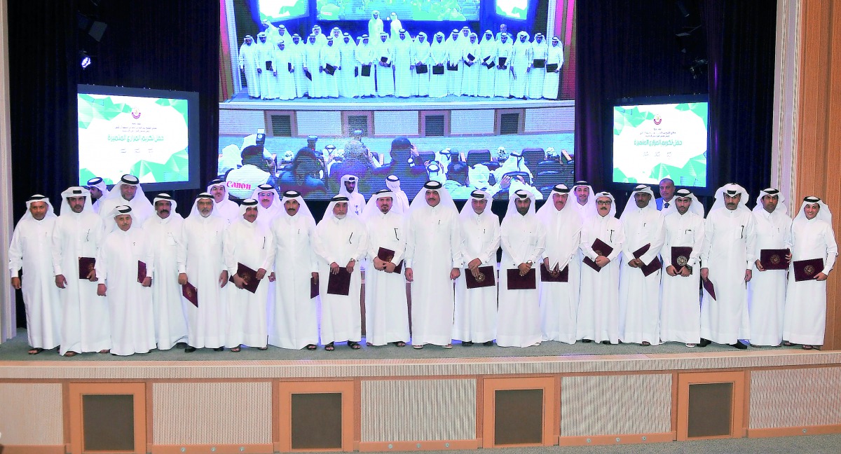 Minister of Municipality and Environment H E Mohamed bin Abdullah Al Rumaihi with agricultural producers yesterday. Pic: Baher Amin / The Peninsula