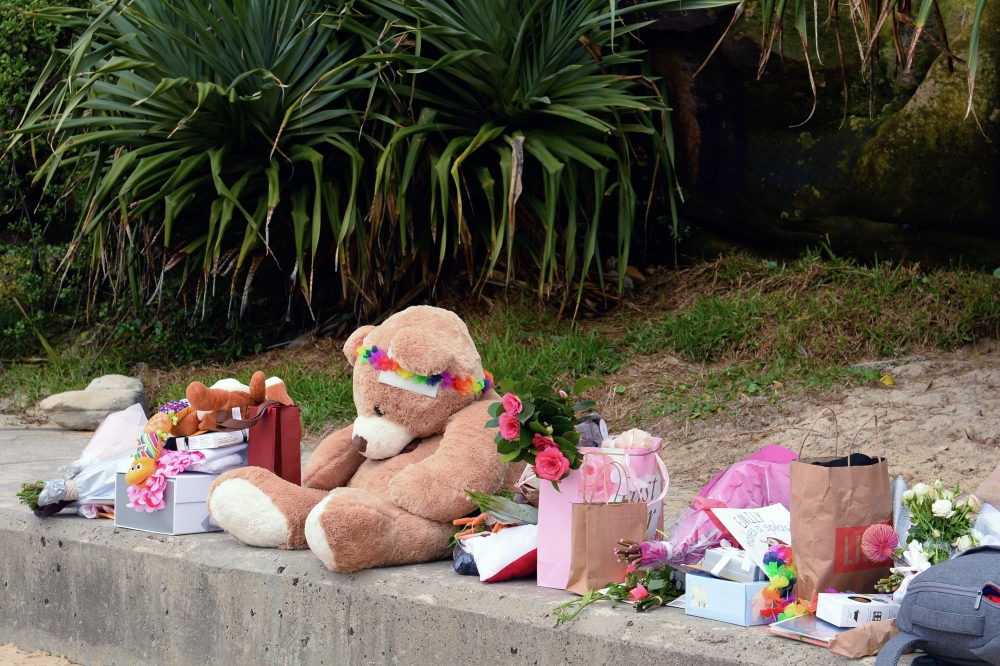Gifts presented by well-wishers to Britain's Prince Harry and his wife Meghan, Duchess of Sussex for their upcoming baby are seen at Sydney's iconic Bondi Beach on October 19, 2018. AFP / Saeed Khan 