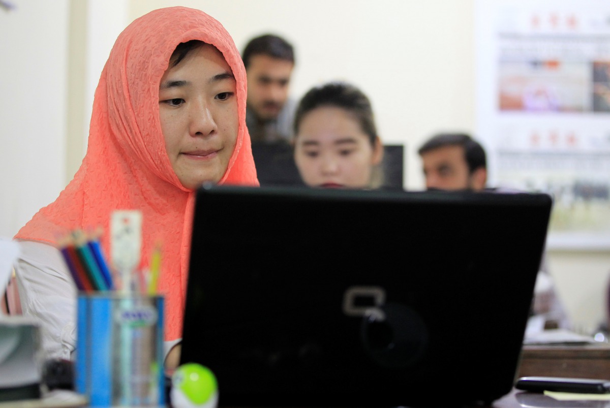 Reporters work at the office of Hushang a Mandarin language weekly newspaper in Islamabad, June 9, 2017. Reuters/Caren Firouz