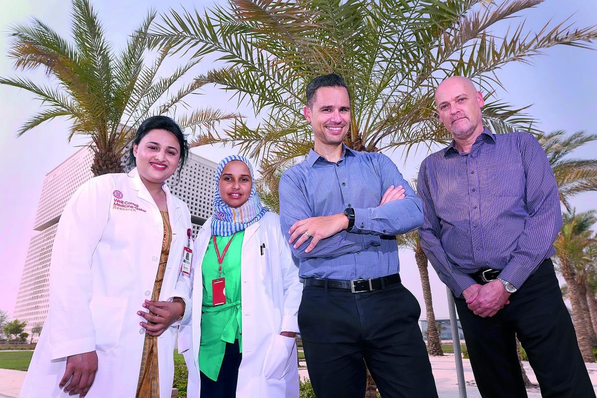 The team of researchers at WCM-Q, who discovered the new method of predicting the gender of date palms, poses for a snap. 