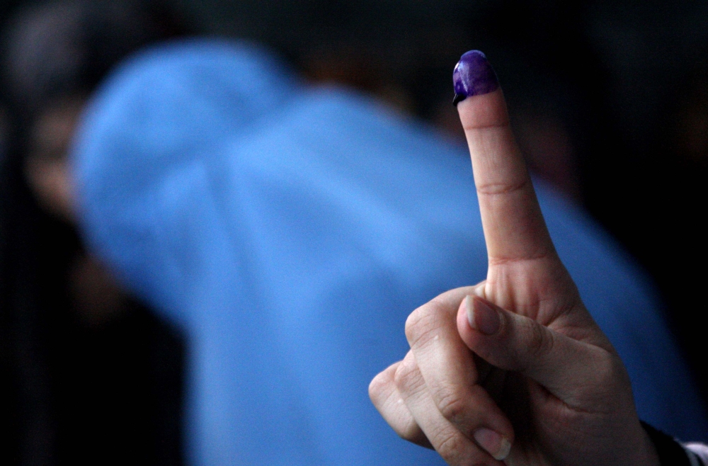 A voter shows an inked finger after casting vote at a polling station during the parliamentary elections in Herat, Afghanistan on October 20, 2018. Mir Ahmad Firooz - Anadolu Agency 