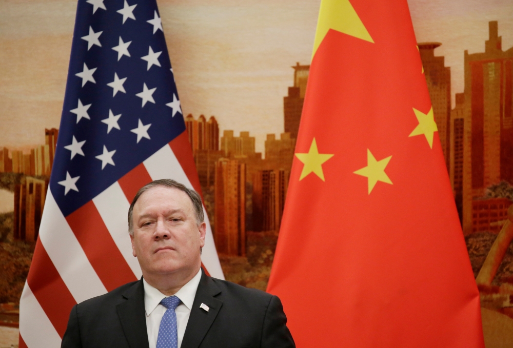 FILE PHOTO: U.S. Secretary of State Mike Pompeo attends a joint news conference with Chinese Foreign Minister Wang Yi (not pictured) at the Great Hall of the People in Beijing, China June 14, 2018. REUTERS/Jason Lee/File Photo