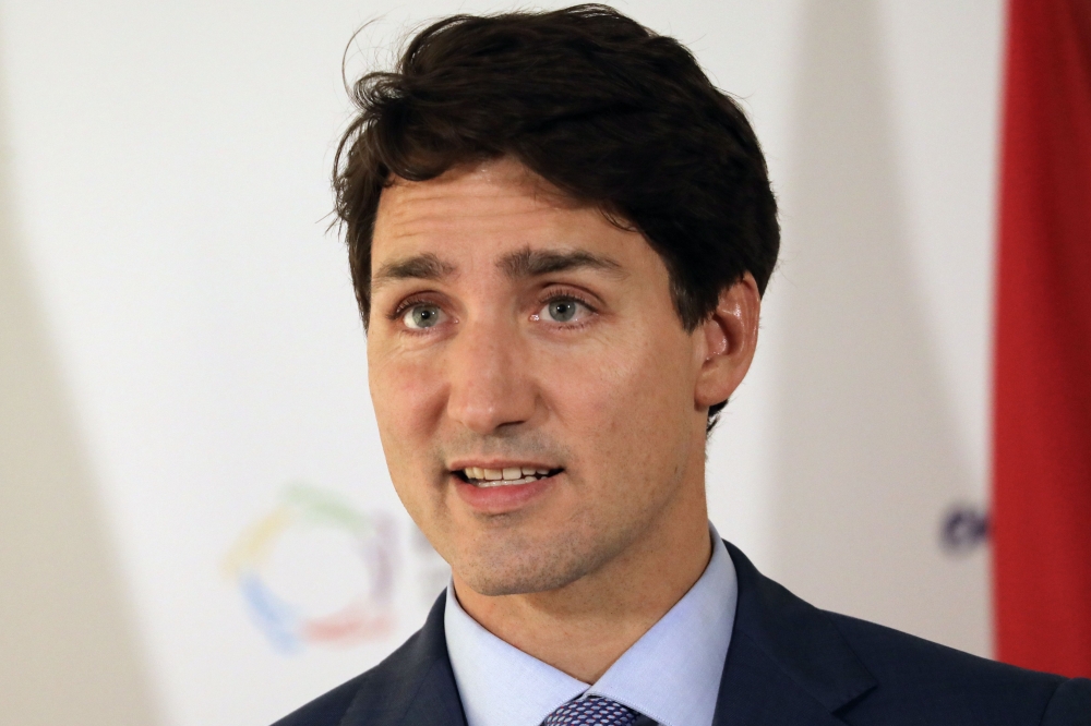 (FILES) In this file photo taken on October 12, 2018 Canada's Prime Minister Justin Trudeau speaks with the media at the end of the 17th Francophone countries summit in Yerevan. AFP / Ludovic MARIN