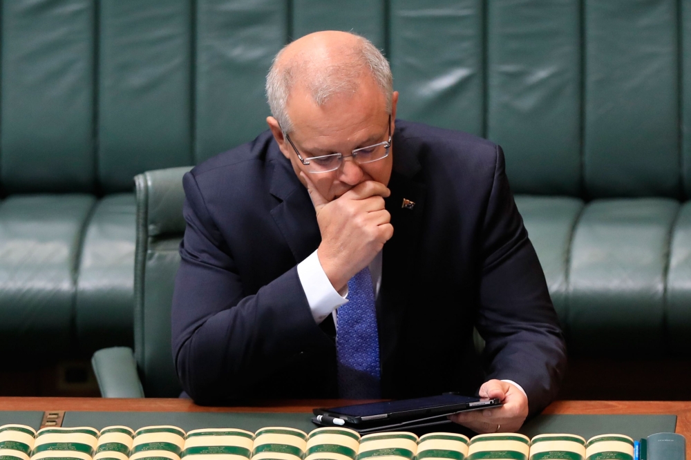 Australia's Prime Minister Scott Morrison prepares to deliver a national apology to child sex abuse victims in the House of Representatives in Parliament House in Canberra on October 22, 2018.  AFP / Sean Davey