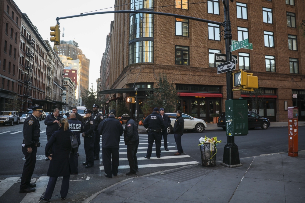 Police gather near the scene of where another package bomb was found early Thursday morning at Robert De Niro's Tribeca Grill restaurant, October 25, 2018 in New York City. (Drew Angerer/Getty Images/AFP)