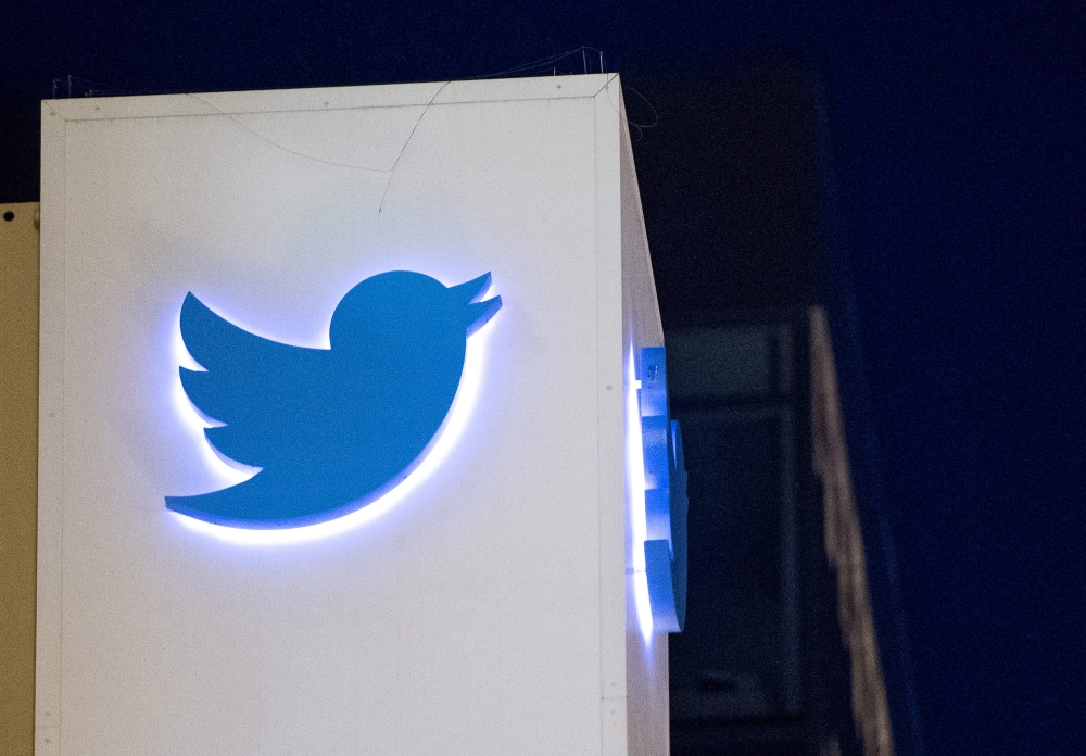 FILE PHOTO: Twitter logo is seen on a sign at the company's headquarters in San Francisco, California.   AFP / JOSH EDELSON