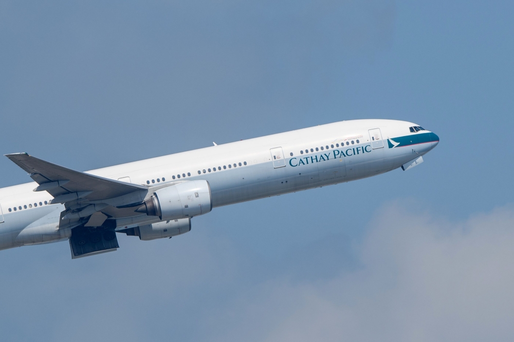 A Cathay Pacific passenger jet takes off from Hong Kong International Airport.  AFP / Anthony WALLACE