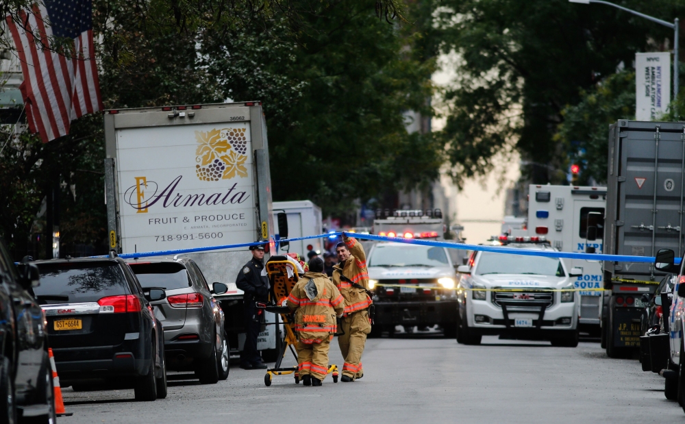 Police and first responders are seen on the scene where suspicious package was found in Midtown Manhattan on October 26, 2018 in New York City. Democratic US Senator Cory Booker is the latest target in a spree of 11 suspicious packages sent to opponents o