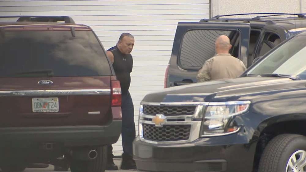 FBI officers escort Cesar Altieri Sayoc into a waiting SUV at FBI headquarters after arresting him in connection with an investigation into a string of parcel bombs in Miramar, Florida, U.S. October 26, 2018. WSVN Ch. 7/Handout via REUTERS 