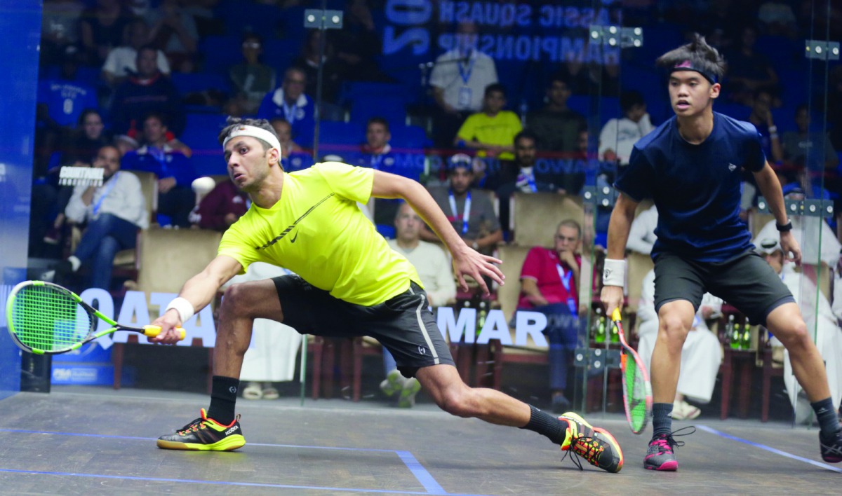 Qatar’s Abdullah Al Tamimi (left) in action against Malaysia’s Eain Yow Ng during the first round of the 2018 Qatar Classic at the Khalifa International Tennis and Squash Complex yesterday. The former world junior champion defeated the home favourite 11-3
