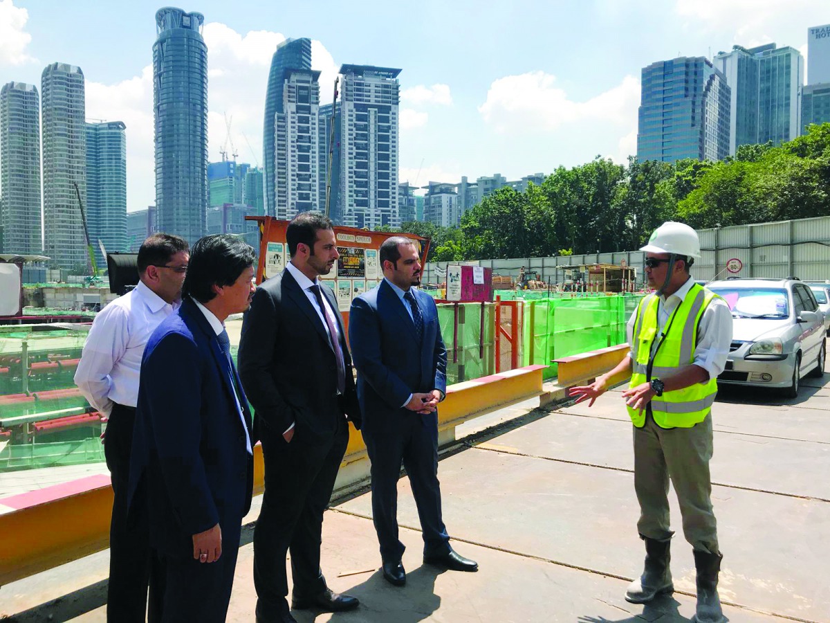 Abdullah bin Hamad Al Attiyah (second left), CEO of Qatari Diar, along with other officials at the project site in Malaysia.
