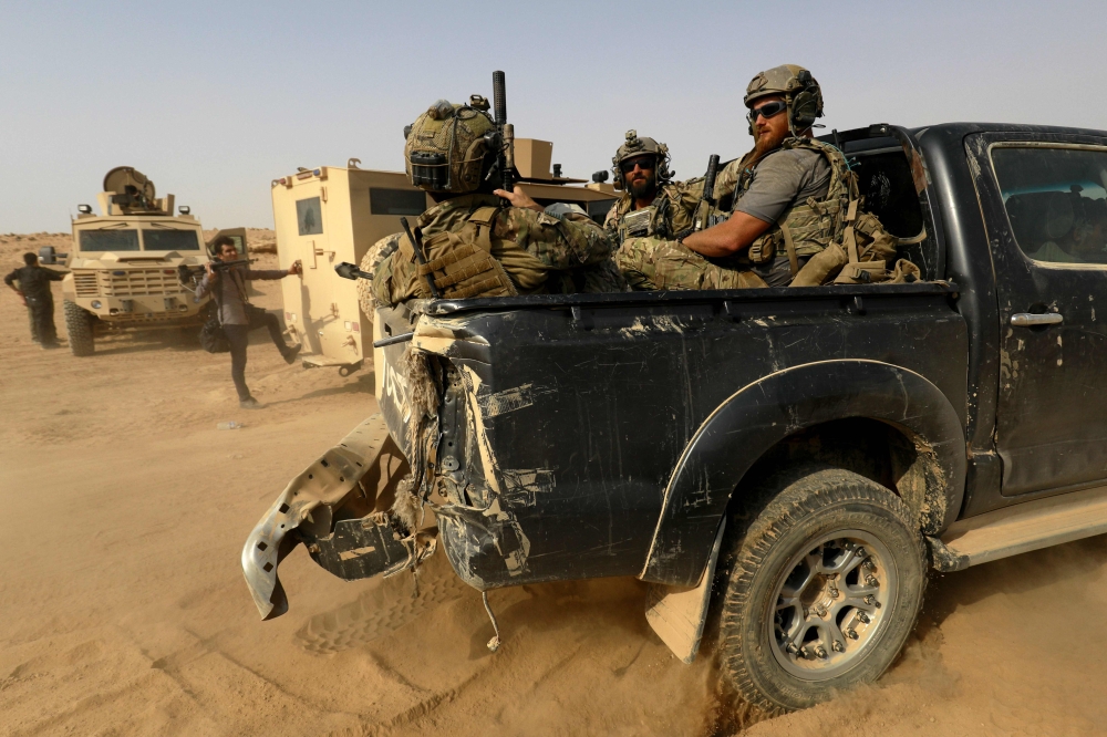 FILE PHOTO: In this file photo taken on September 13, 2018, US-backed forces are pictured near the village of Susah in the eastern province of Deir Ezzor, near the Syrian border with Iraq. AFP / Delil souleiman
