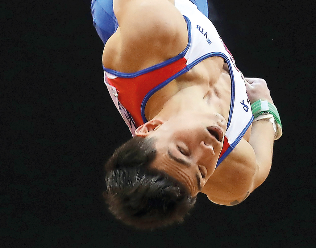 Artur Dalaloyan of Russia competes in the Men’s horizontal bar during the Men’s Team final of the 2018 FIG Artistic Gymnastics Championships at Aspire Dome in Doha on  Monday.