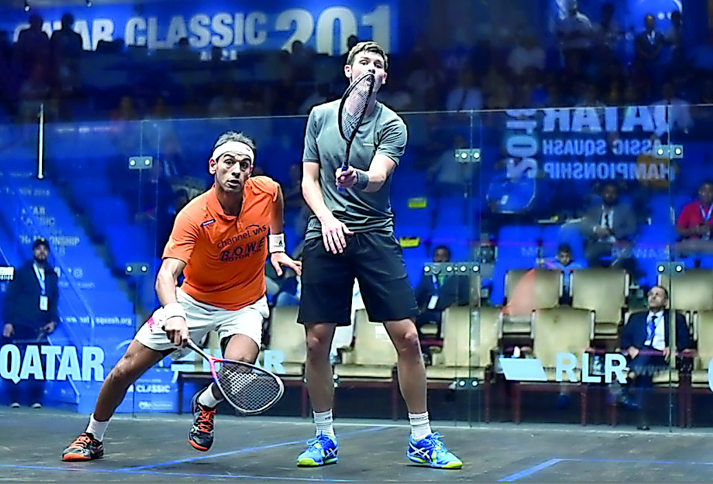 Egyptian world number one Mohamed El Shorbagy (left) in action against England’s Adrian Waller during their third round match of the Qatar Classic yesterday. 
