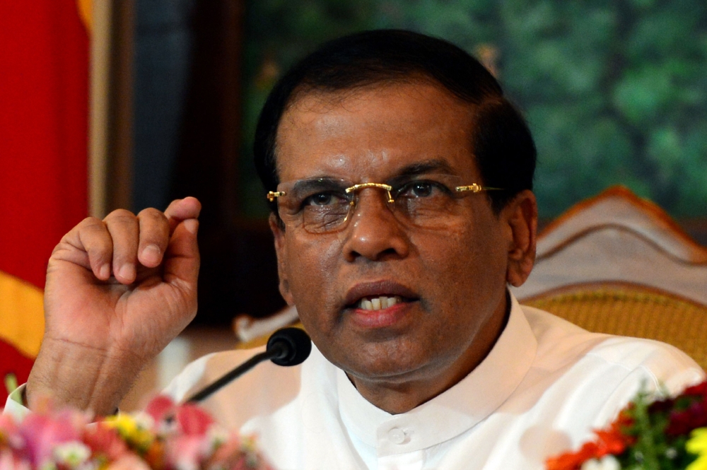(FILES) In this file photo taken on October 3, 2015 Sri Lankan President Maithripala Sirisena makes a televised statement from his official residence in Colombo. AFP / Lakruwan WANNIARACHCHI