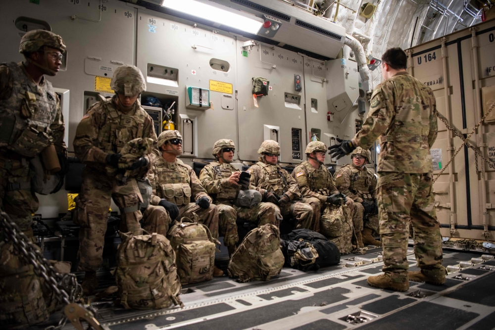 In this image from the US Air Force, Airman 1st Class Trevor Pearce briefs troops aboard a C-17 Globemaster III at Fort Knox, Kentucky, on October 30, 2018, part of the support for Operation Faithful Patriot. AFP PHOTO / US Air Force / Airman 1st Class Zo
