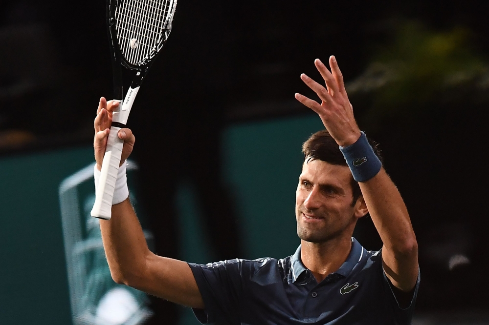 Serbia's Novak Djokovic celebrates after winning his tennis match against Bosnia-Herzegovina's Damir Dzumhur, at the end of their men's singles third round tennis match on day four of the ATP World Tour Masters 1000 - Rolex Paris Masters - indoor tennis t