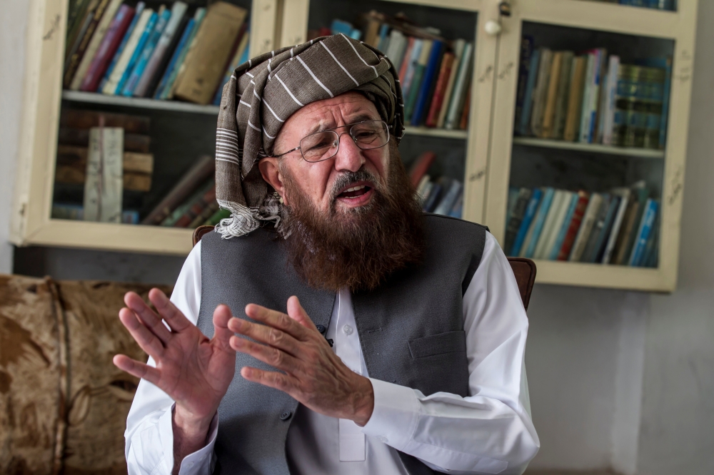 FILE PHOTO: Maulana Sami-ul Haq, a Pakistani cleric and head of Darul Uloom Haqqania, an Islamic seminary and alma mater of several Taliban leaders, talks during an interview with Reuters at his house in Akora Khattak, Khyber Pakhtunkhwa province Septembe