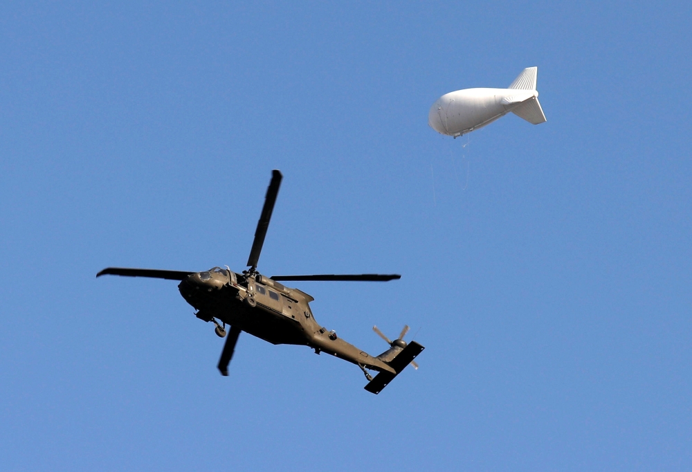 A NATO helicopter flies over the Resolute Support headquarters in Kabul, Afghanistan November 3, 2018.REUTERS/Mohammad Ismail
