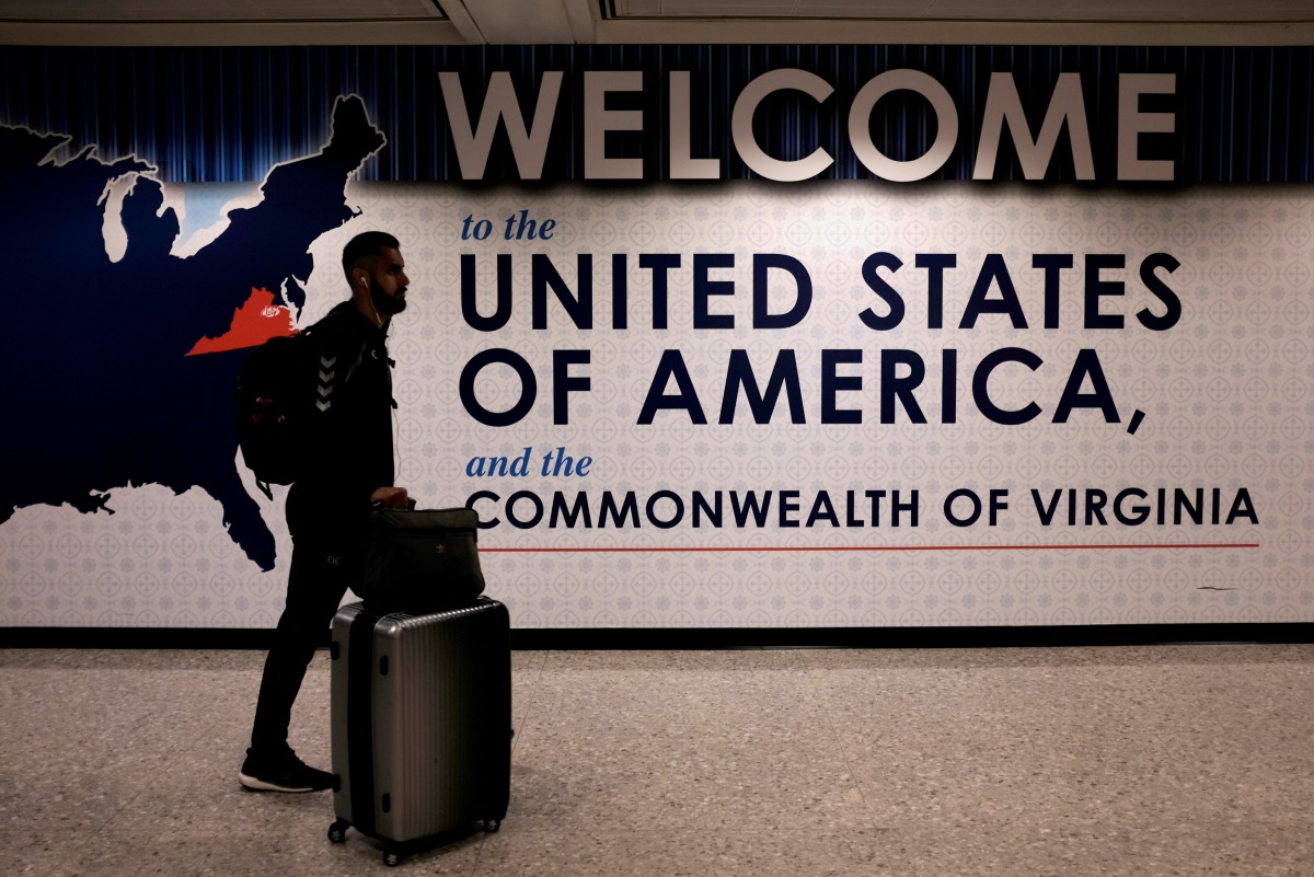 An international passenger arrives at Washington Dulles International Airport in Dulles, Virginia on June 26, 2017. Reuters/James Lawler Duggan