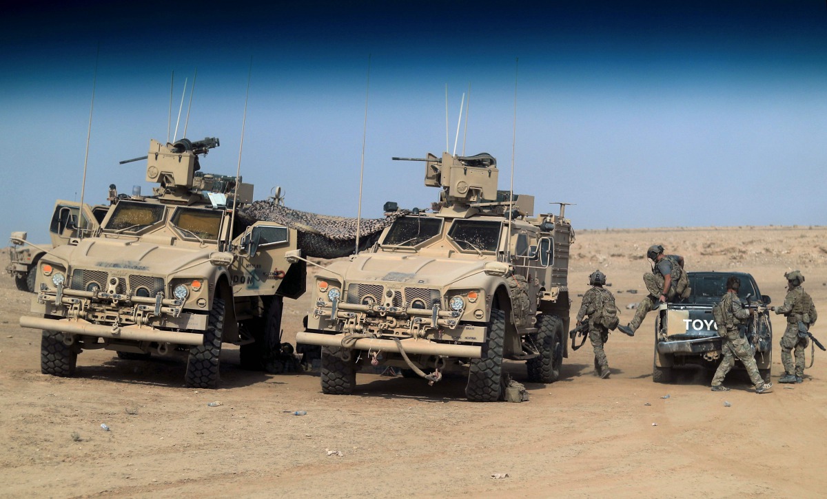 In this file photo dated September 14, 2018, US-backed forces are pictured near the village of Susah in the eastern province of Deir Ezzor, near the Syrian border with Iraq. AFP / Delil souleiman

