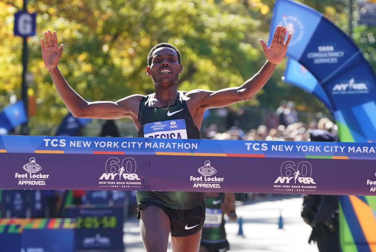 Lelisa Desisa of Ethipoia crosses the finish line to win the Men's Division during the 2018 TCS New York City Marathon in New York on November 4, 2018.  AFP / Timothy A. Clary
