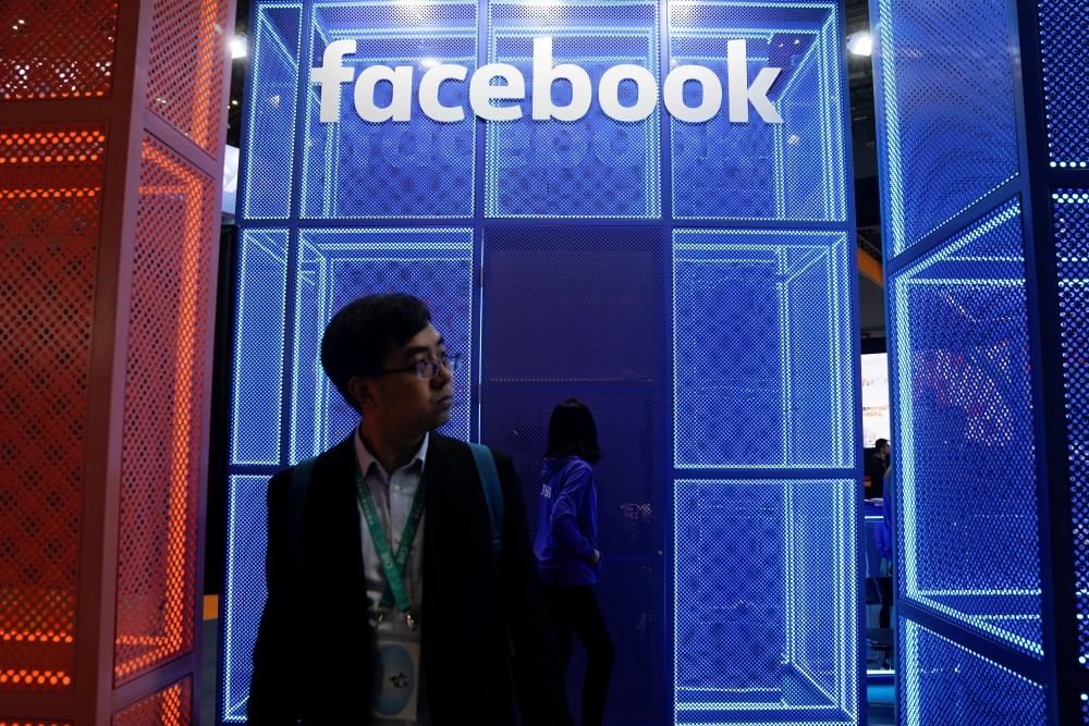 A Facebook sign is seen during the China International Import Expo (CIIE), at the National Exhibition and Convention Center in Shanghai, China November 5, 2018. REUTERS/Aly Song
