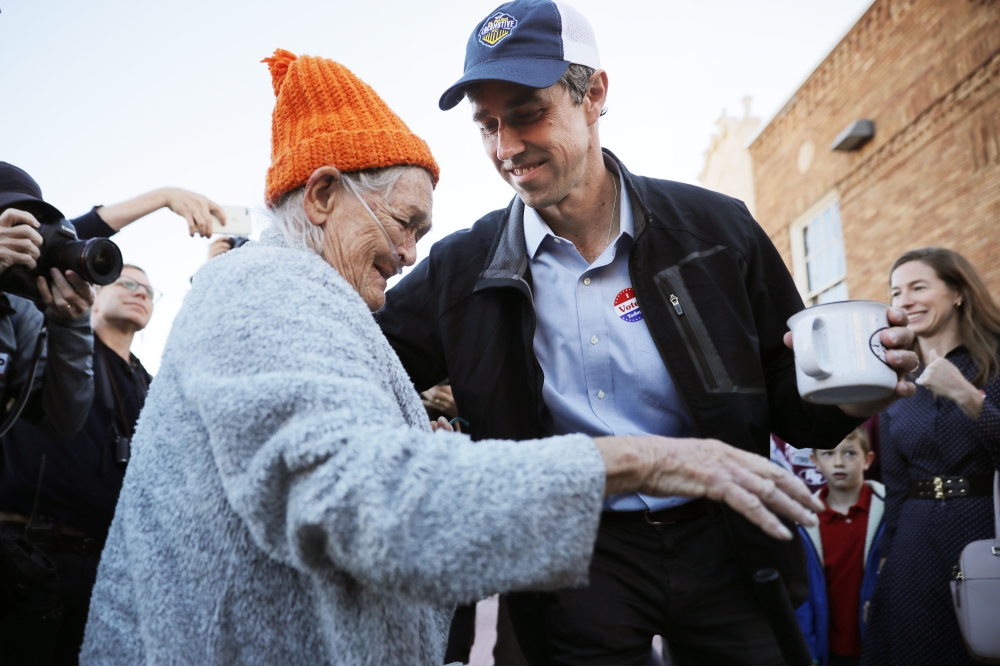 U.S. Senate candidate Rep. Beto O'Rourke (D-TX) (R) talks with supporters after he cast his ballot at El Paso Community College-Rio Grande Campus on Election Day November 06, 2018 in El Paso, Texas. Chip Somodevilla/AFP 