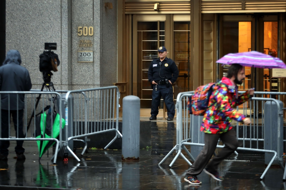 A police officer watches over the entrance to the Daniel Patrick Moynihan United States Courthouse ahead of the appearance by alleged mail bomber Cesar Sayoc in the United States District Court for the Southern District of New York on November 6, 2018 in 