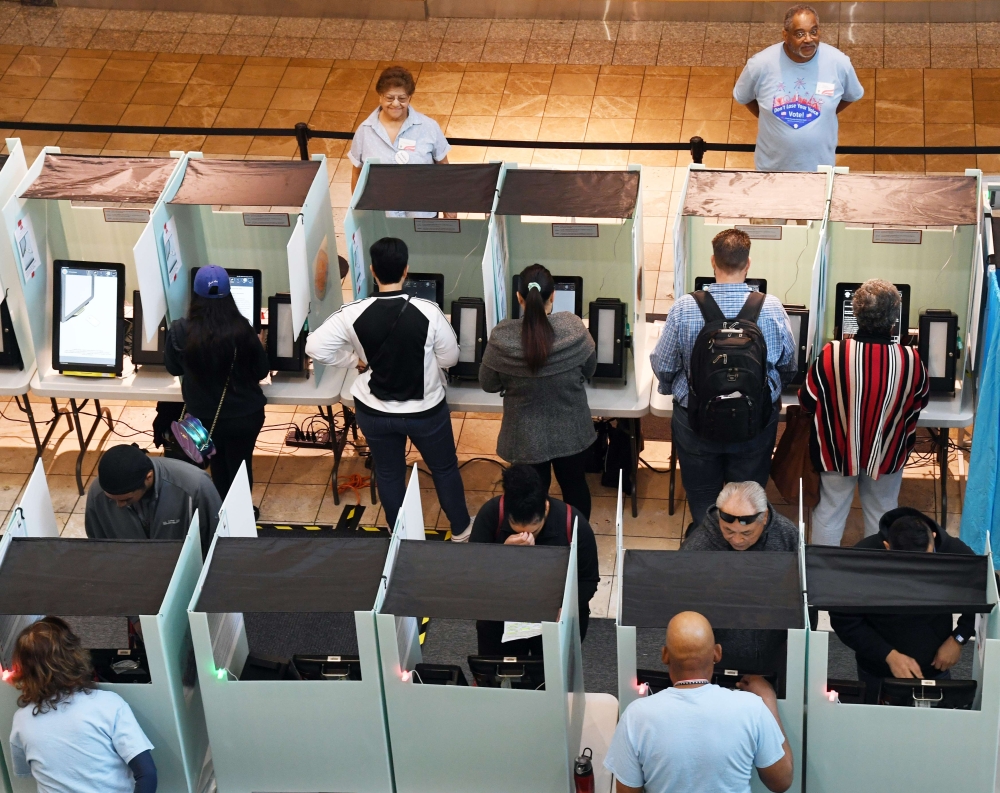 People vote at the Galleria at Sunset mall on November 6, 2018 in Henderson, Nevada. Americans vote on their choices of candidates in this midterm election, which is seen by many as a referendum on President Donald Trump. Ethan Miller/AFP