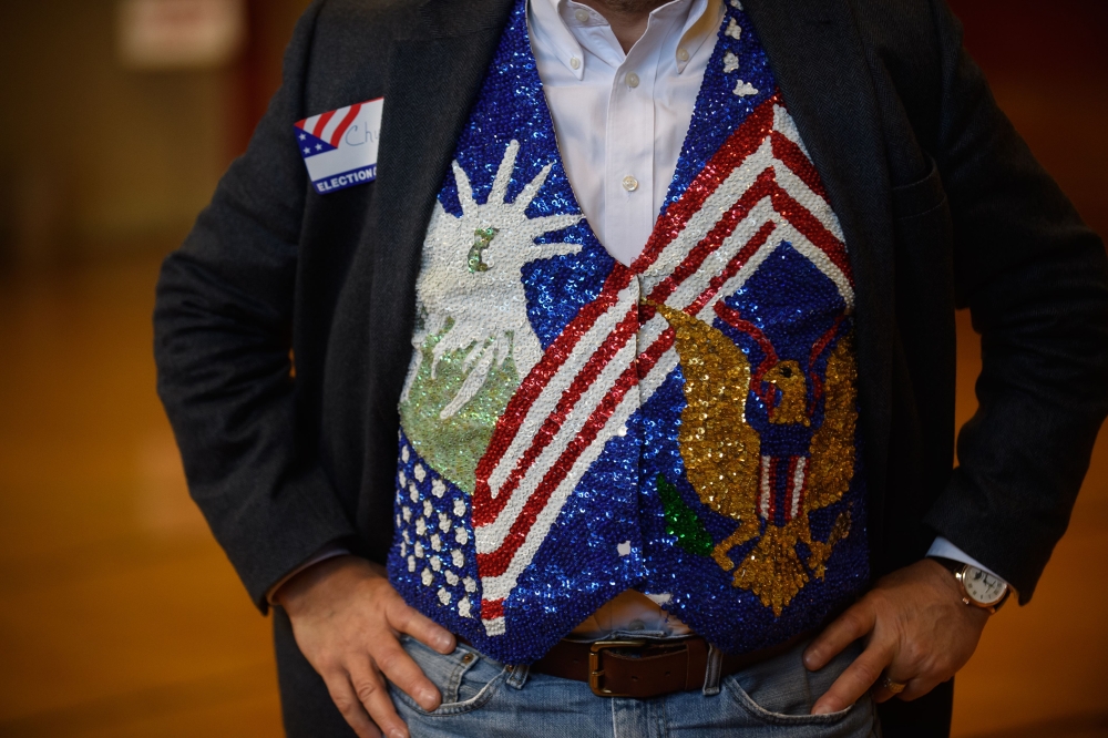 Chuck Keiper 57 shows off a vest he has worn as an election official for 12 years at the Franklin Elementary School on November 6, 2018 in Kent, Ohio.  Jeff Swensen/Getty Images/AFP 