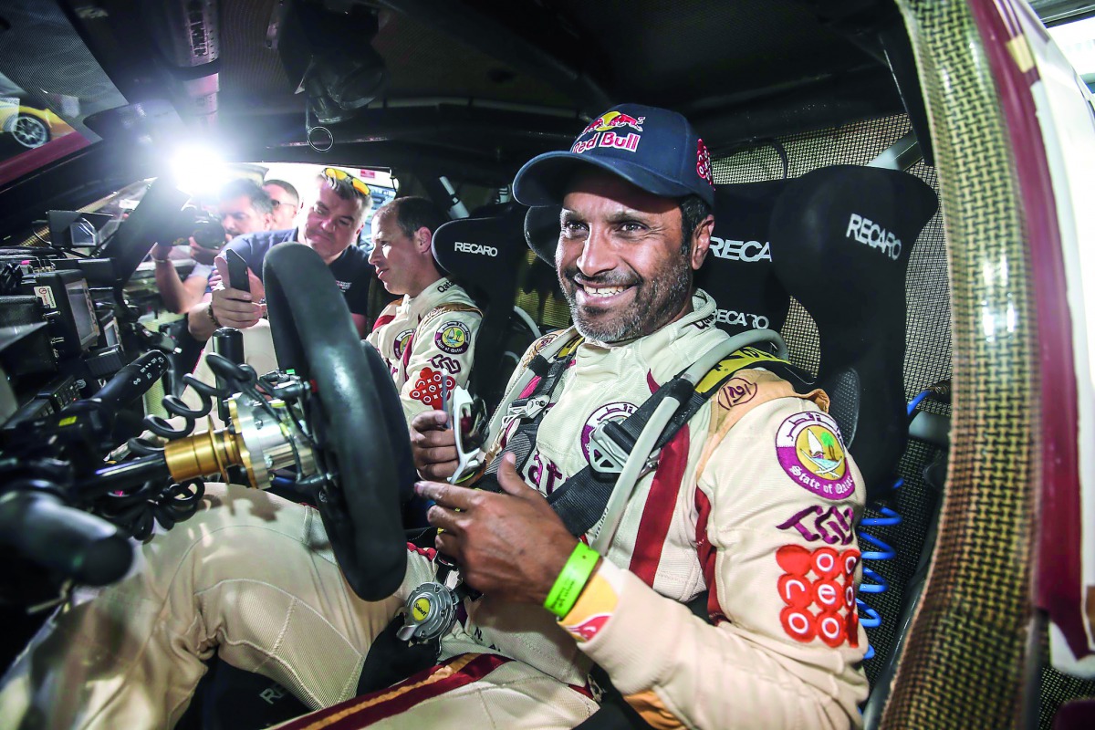 Qatar’s 14-time regional champion Nasser Saleh Al Attiyah gestures during a break. 



