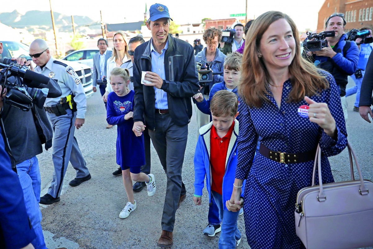 US Senate candidate Rep. Beto O’Rourke, his wife Amy Sanders (right) and their children Henry, Ulysses and Molly, walk back home after voting at El Paso Community College-Rio Grande Campus on Election Day in El Paso, yesterday. 
