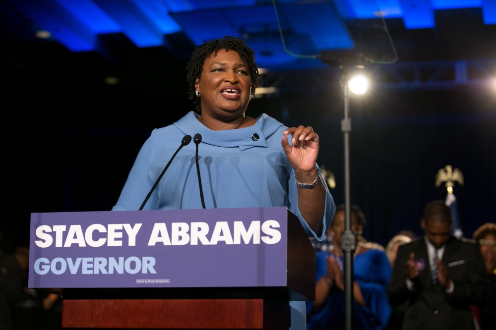 Democratic Gubernatorial candidate Stacey Abrams addresses supporters at an election watch party on November 6, 2018 in Atlanta, Georgia. Jessica McGowan/Getty Images/AFP 