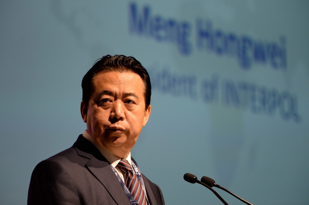 In this file photo taken on July 4, 2017 Meng Hongwei of Interpol gives an addresses at the opening of the Interpol World Congress in Singapore. AFP/Roslan Rahman