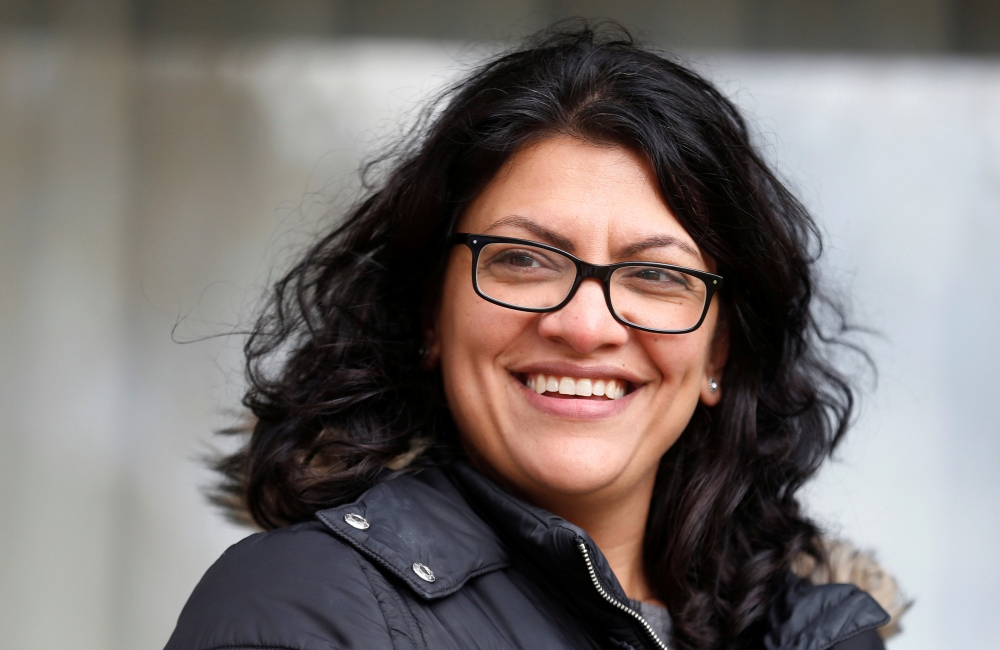 Democratic US congressional candidate Rashida Tlaib canvasses a neighborhood before Election Day in Detroit, Michigan, U.S. November 5, 2018. Reuters/Rebecca Cook