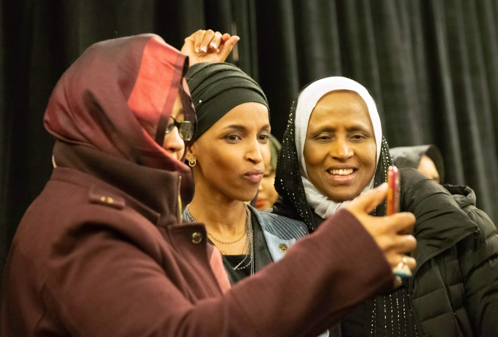 Ilhan Omar, newly elected to the U.S. House of Representatives on the Democratic ticket, celebrates with her supporters after her Congressional 5th District primary victory in Minneapolis, Minnesota on November 6, 2018.  AFP / Kerem Yucel  

 